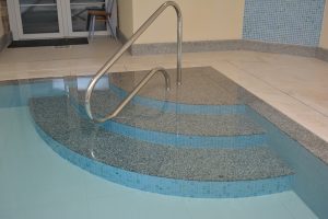Granite internal radius pool steps.