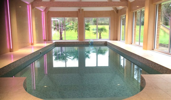 Travertine Roman end on indoor pool