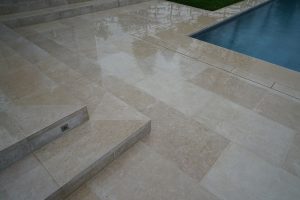 Fossil Pearl Satin Contemporary Limestone paving when wet