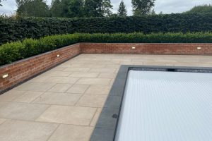 Black Pool Coping with contrasting Leckford Sandstone Paving
