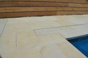 Danebury Sandstone paving with a pit lid detail 