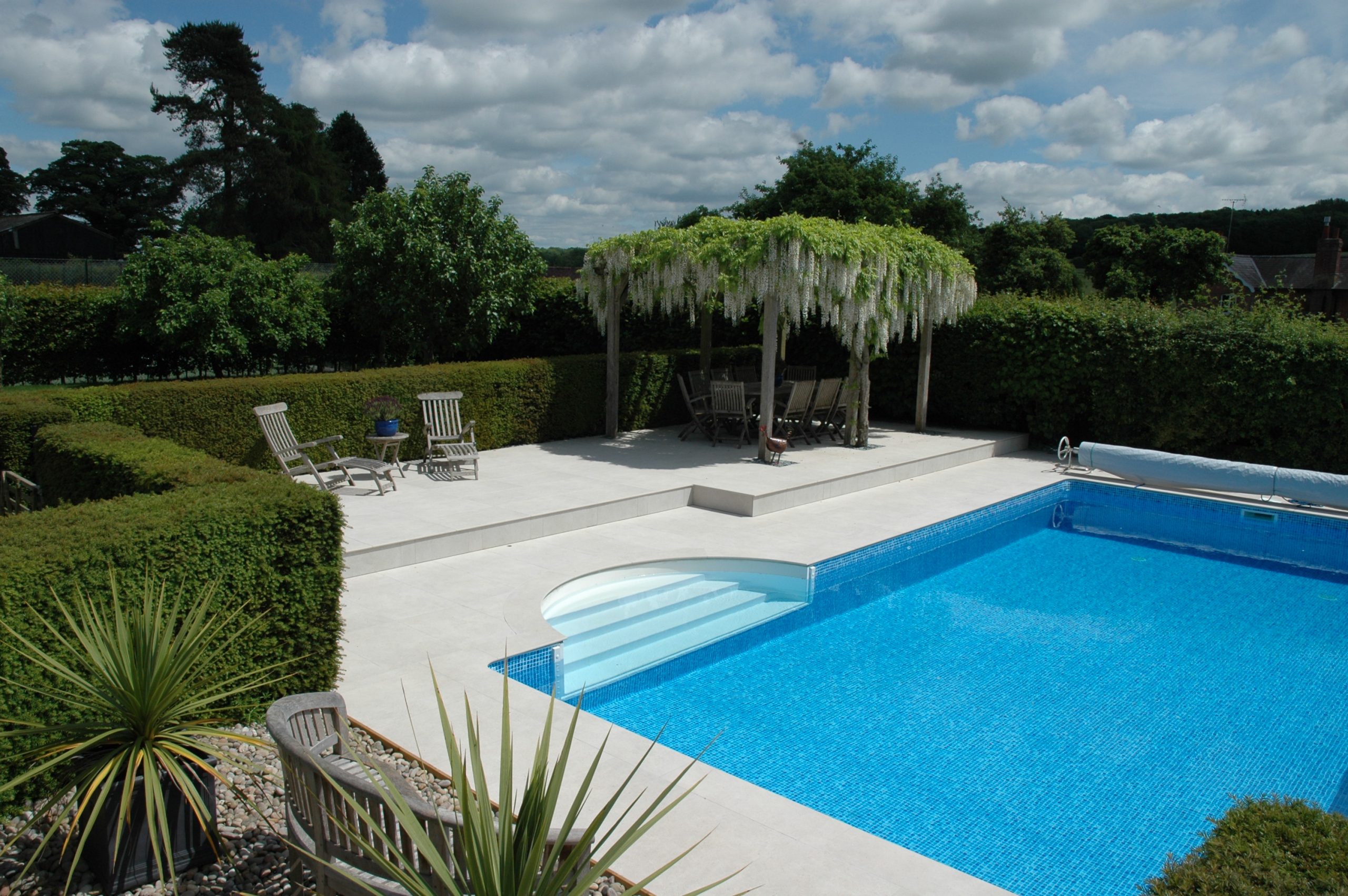 Awbridge Porcelain Non Slip With Bespoke Roman End Pool Copings And Matching Paving By Cranbourne Stone Ltd Scaled 